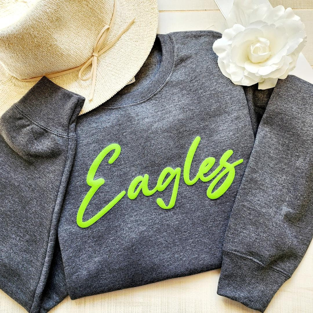 a gray sweatshirt with the word eagles on it